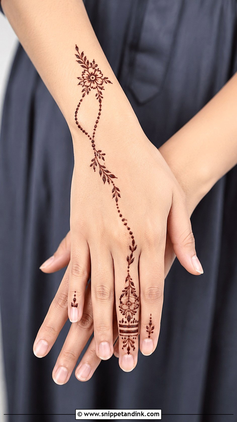 Back Hand Mehndi Design With Index Finger Trail - Snippet and Ink - 35 Simple Back Hand Mehndi Designs