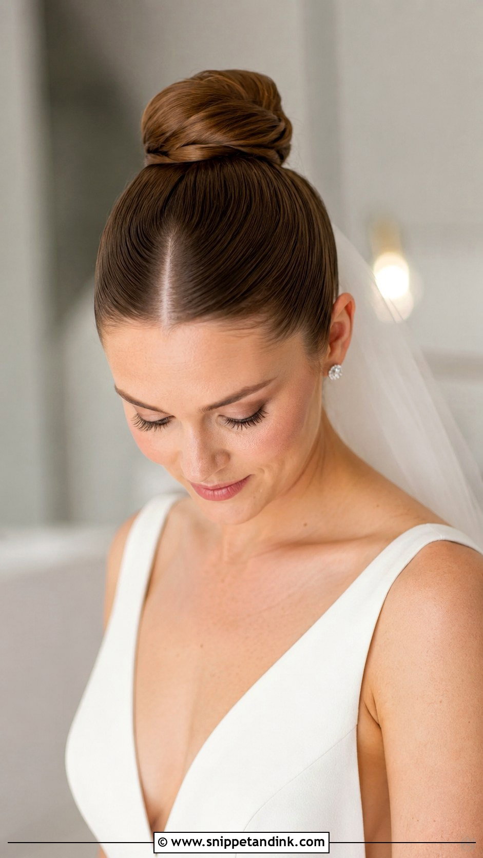 Ballerina Bun With Center Part - Snippet and Ink - 30 High Bun Wedding Hair Ideas