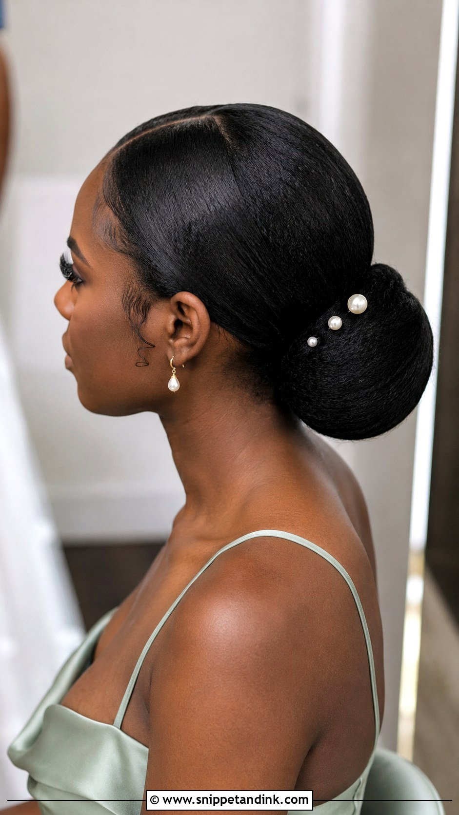 Black Bridesmaid Low Bun - Snippet and Ink - 20 Black Wedding Hairstyles Bridesmaid