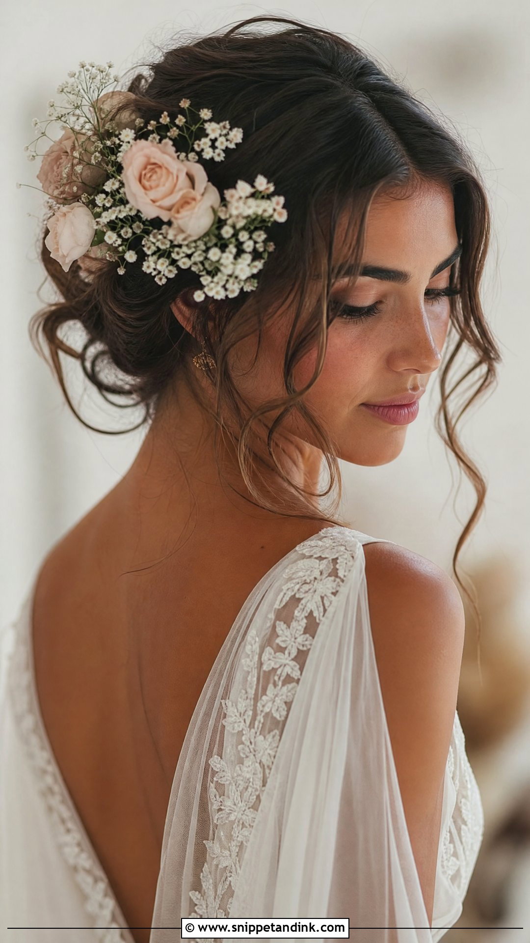 Bohemian Bun With Flowers - Snippet and Ink - 20 Bride Bun Hairstyle Ideas