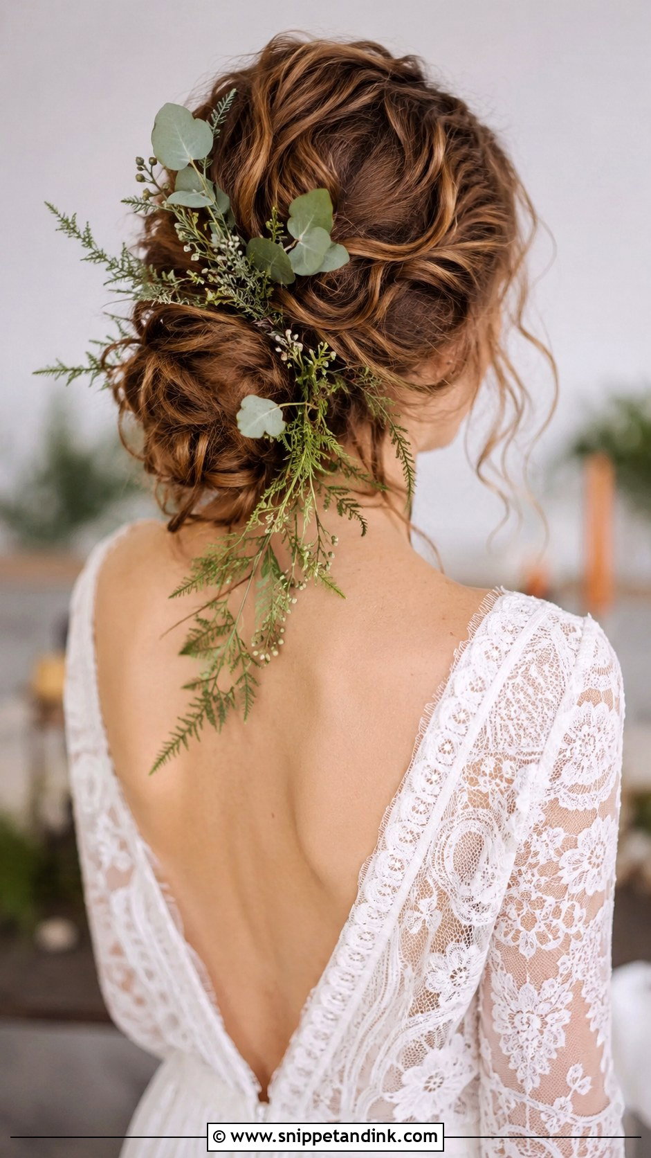 Bohemian Low Bun With Greenery - Snippet and Ink - 30 Low Updo Wedding Hair Ideas