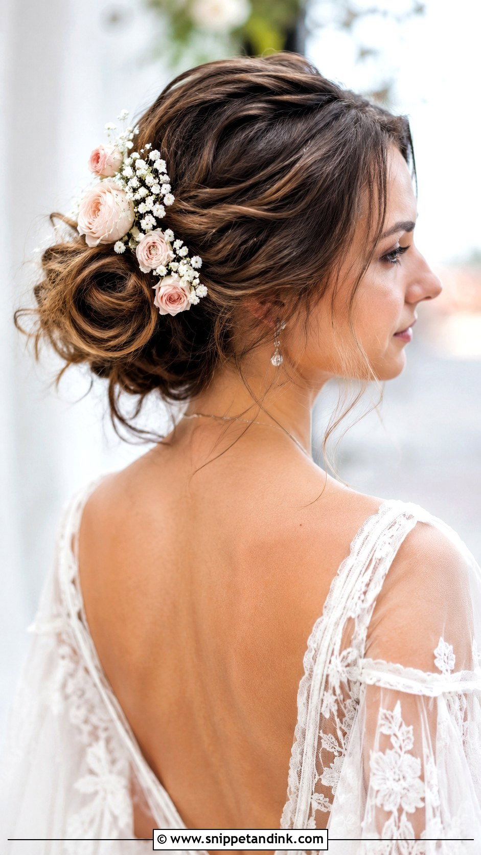 Boho Loose Bun With Flowers - Snippet and Ink - 25 Loose Bun Wedding Hair Ideas