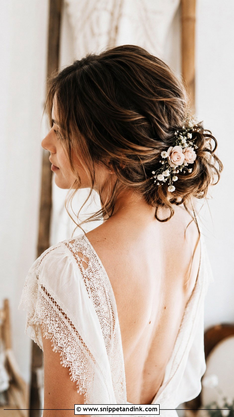 Boho Messy Bun With Flowers - Snippet and Ink - 20 Messy Bun Wedding Hairstyles