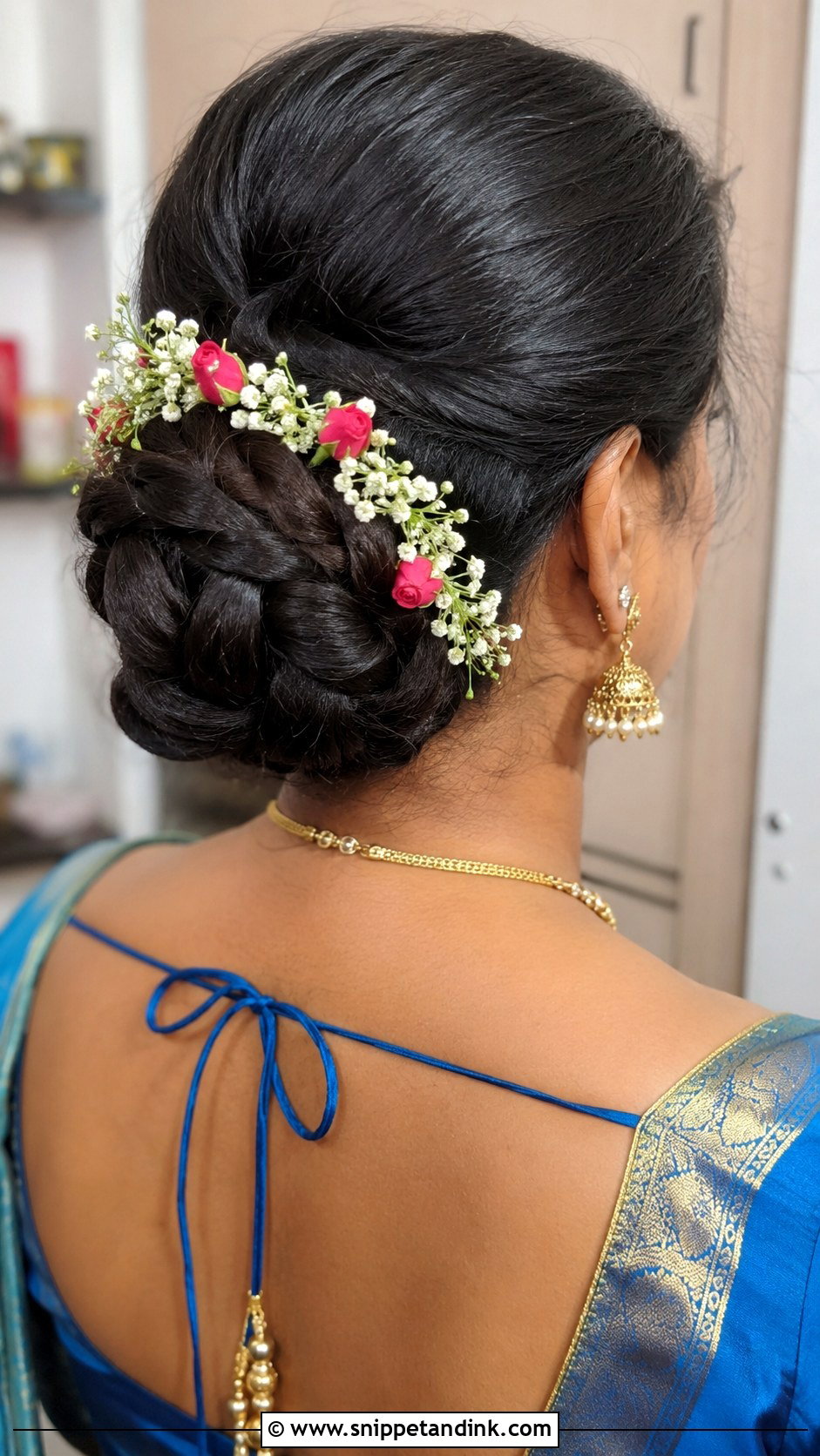 Braided Bun With Floral Accents - Snippet and Ink - 25 Telugu Bride Hairstyles