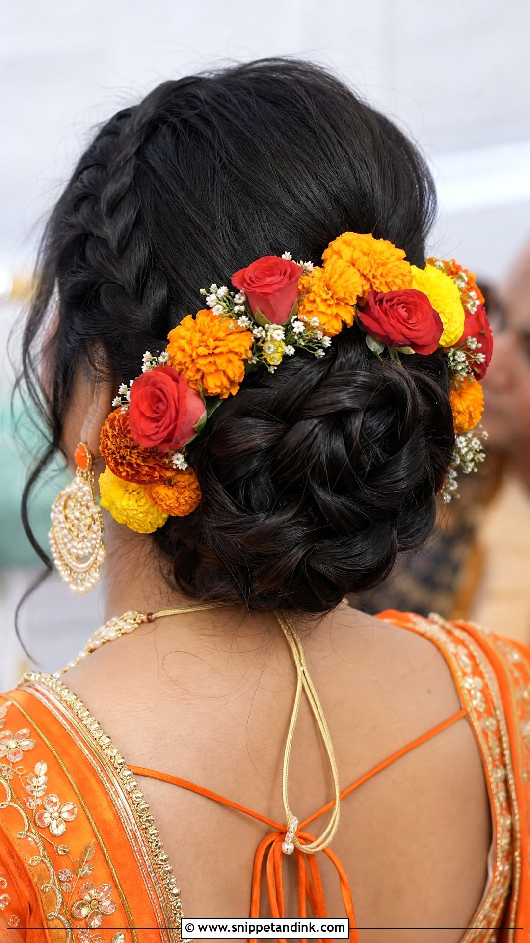 Braided Bun With Fresh Flowers - Snippet and Ink - 20 Indian Wedding Bun Bridal Hairstyle Ideas