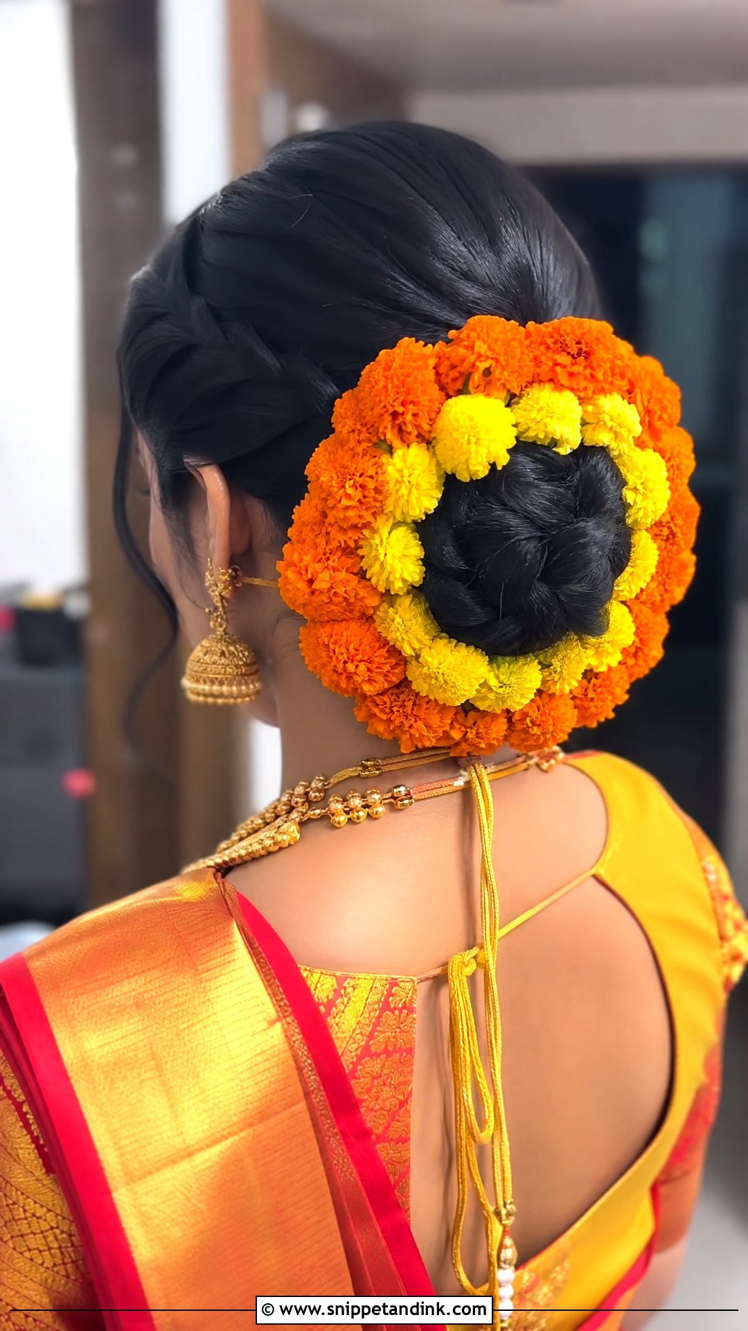 Braided Bun With Fresh Marigolds - Snippet and Ink - 20 South Indian Wedding Hairstyles for Short Hair