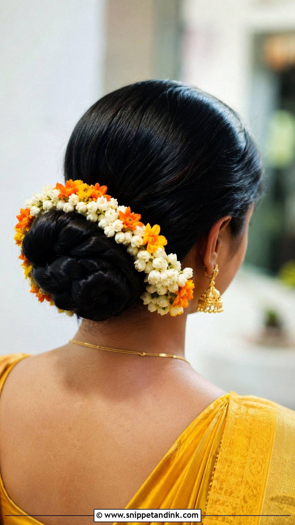 Braided Low Bun With Gajra - Snippet and Ink - 20 Haldi Braid Hairstyles for Bride