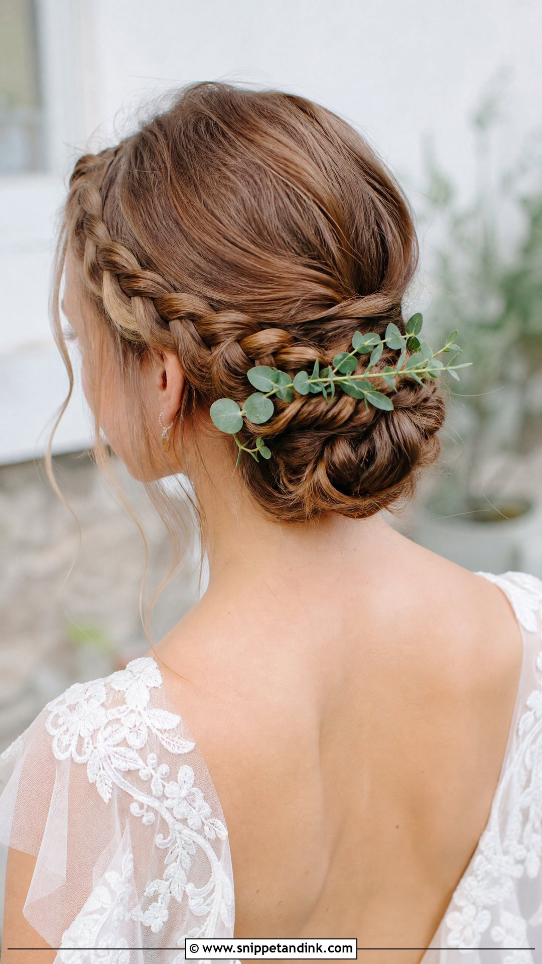 Braided Low Bun With Greenery - Snippet and Ink - 20 Unique Bridal Hairstyles