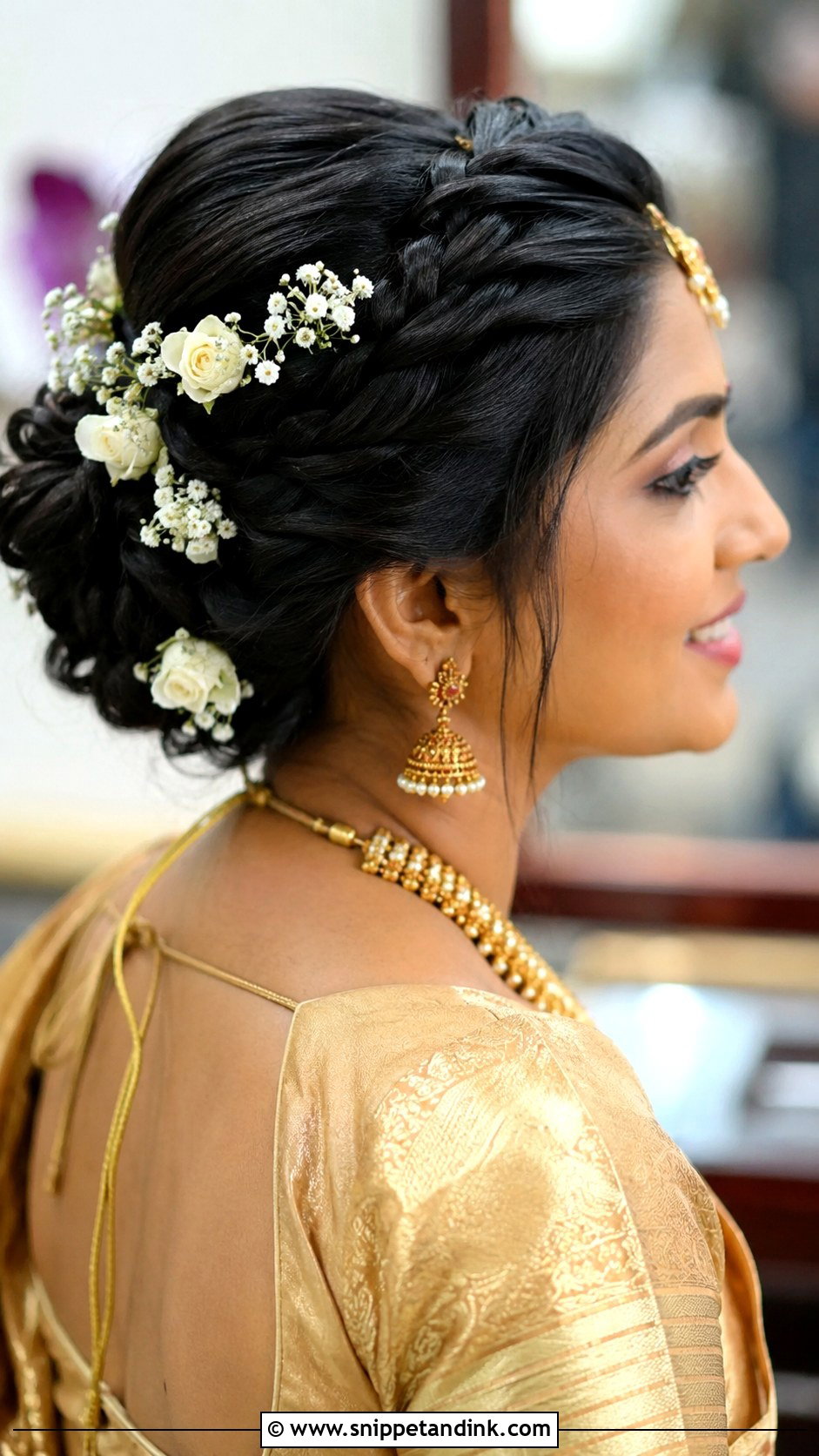 Braided Updo With Pinned Flowers - Snippet and Ink - 30 Kerala Bride Hairstyles