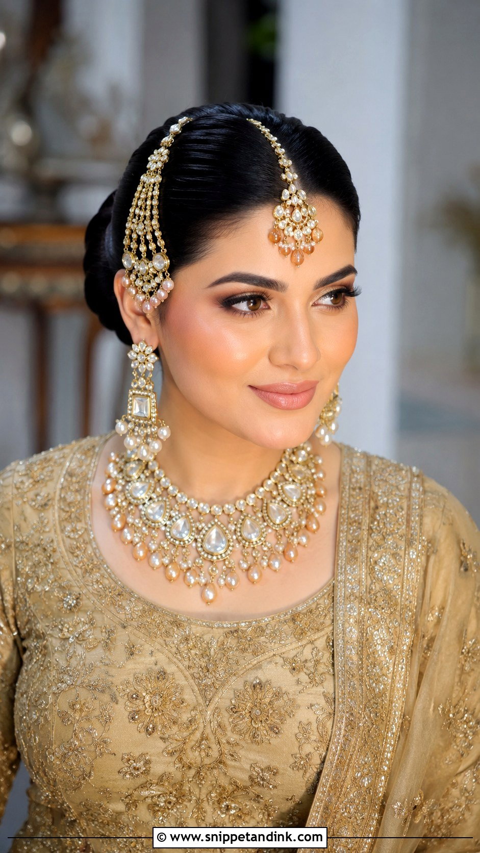 Bun With Maang Tikka And Jhoomar - Snippet and Ink - 25 Indian Front Look Bridal Bun Hairstyles