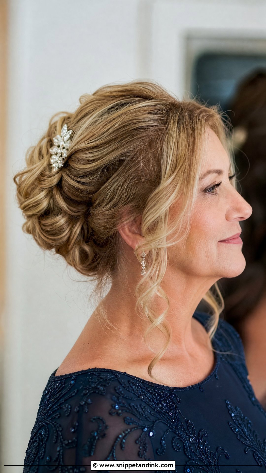 Classic Updo with Curled Tendrils - Snippet and Ink - 20 Mother Hairstyles for Wedding