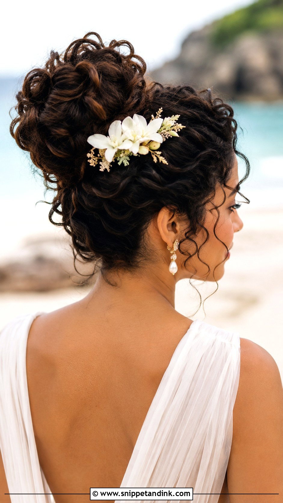 Curly Big Bun For Beach Weddings - Snippet and Ink - 30 Curly Hair Wedding Styles