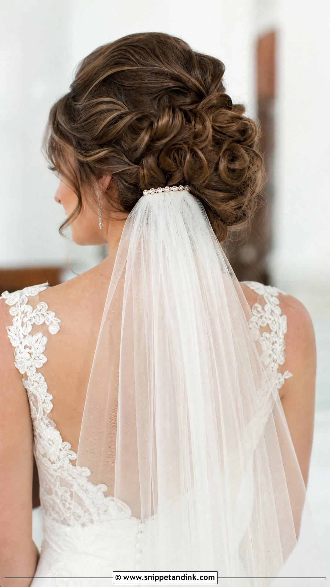 Curly Bridal Bun With Veil - Snippet and Ink - 30 Wedding Hairstyles for Curly Hair