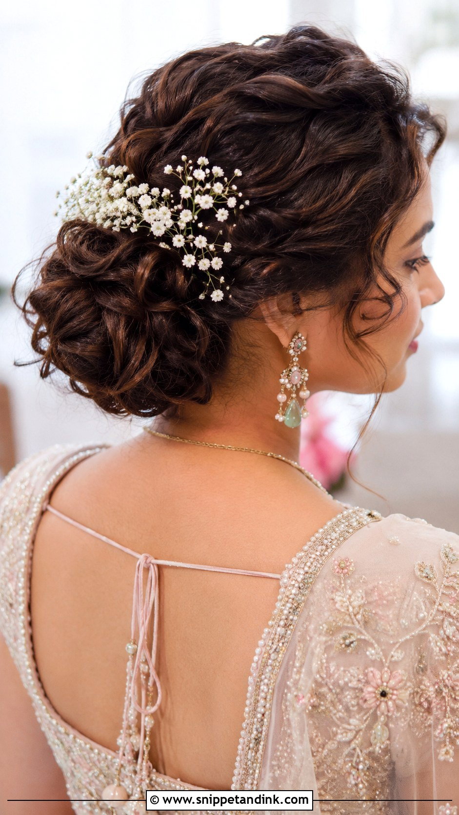 Curly Bun With Babys Breath - Snippet and Ink - 20 Indian Hair Styles for Weddings