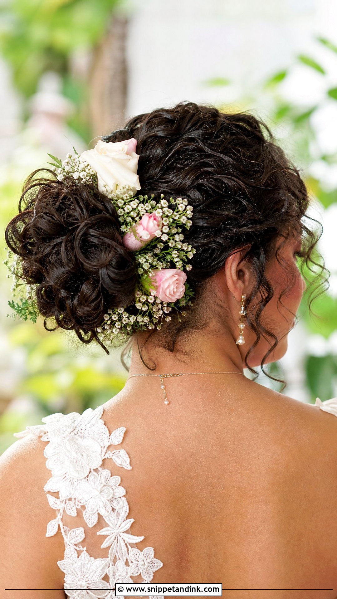 Curly Bun With Flowers Wedding Hairstyle - Snippet and Ink - 20 Curly Bun Wedding Hairstyles
