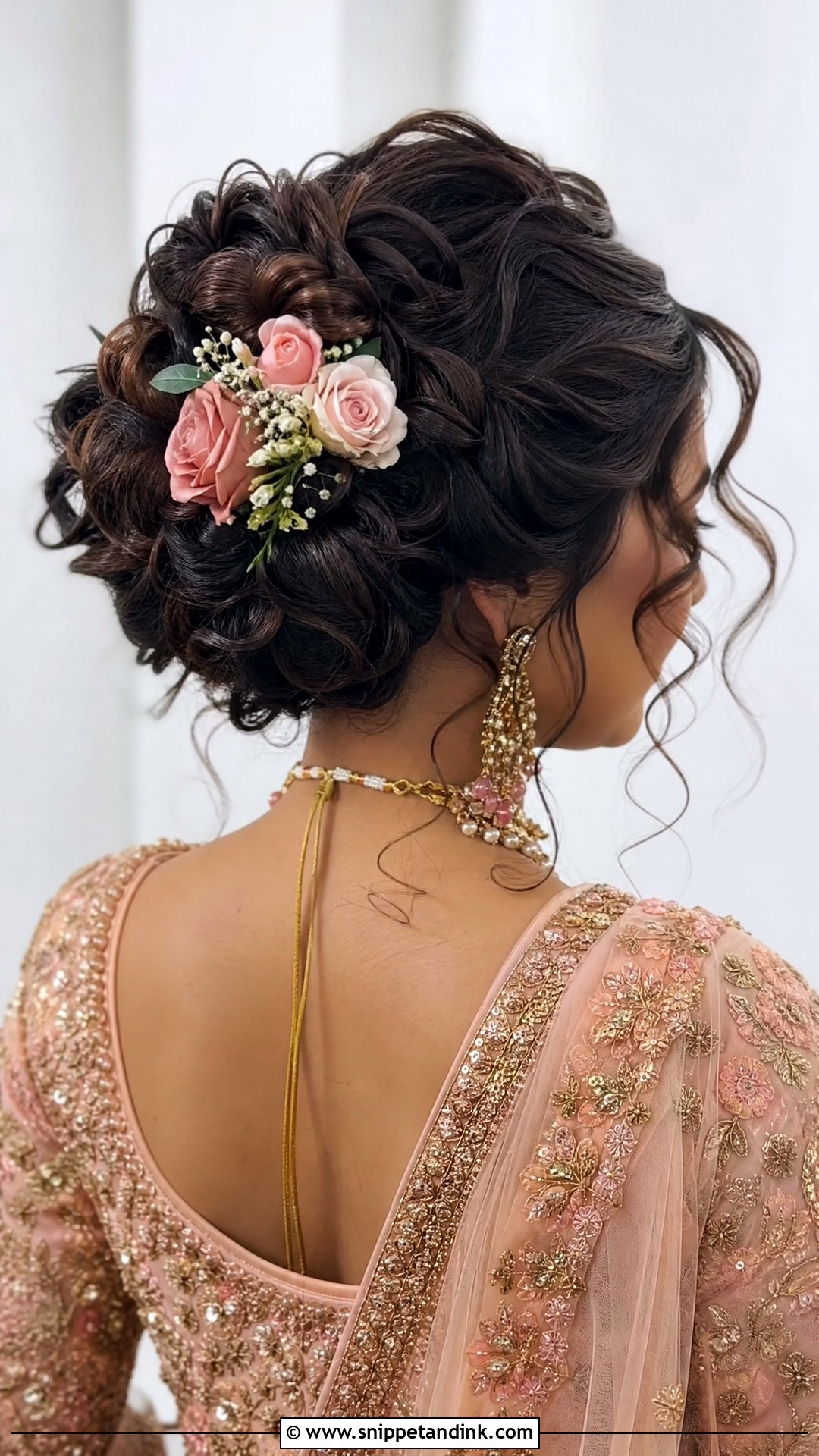 Curly Bun With Flowers - Snippet and Ink - 20 Punjabi Bride Hairstyle Ideas