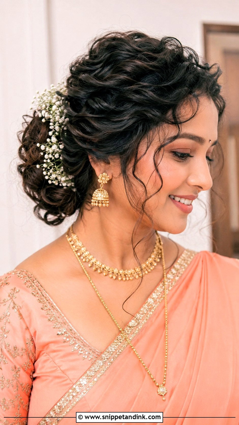 Curly Bun With Loose Strands - Snippet and Ink - 25 Marathi Bride Hairstyle Ideas