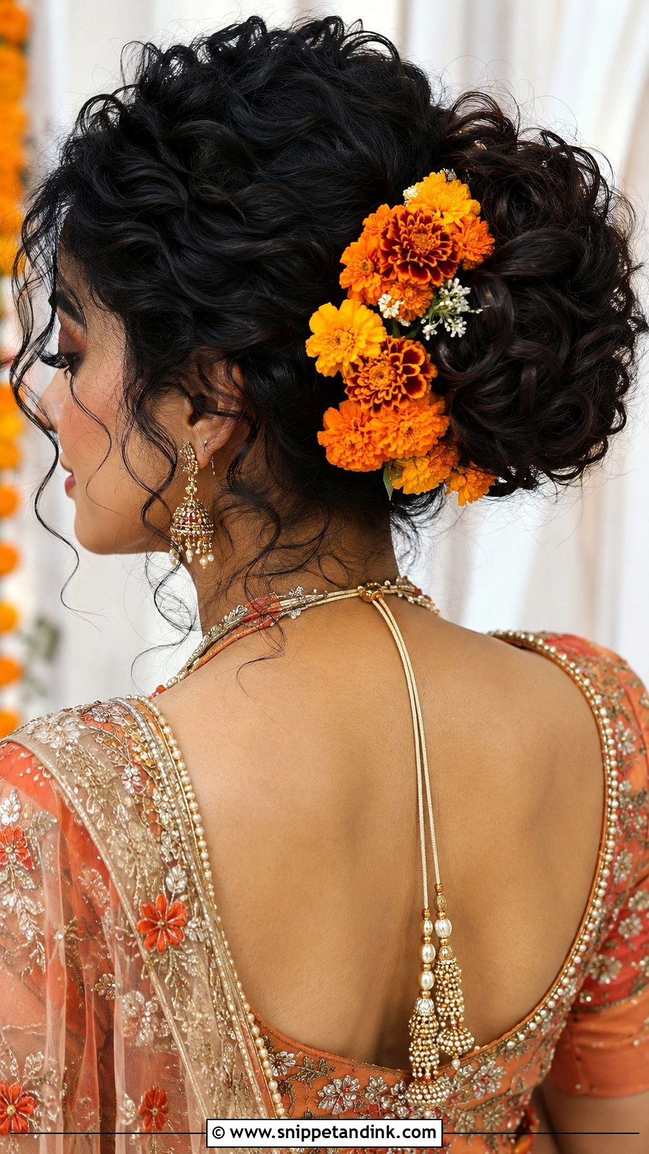 Curly Bun With Marigolds - Snippet and Ink - 20 Flower Bun Hairstyle Wedding Bride Ideas