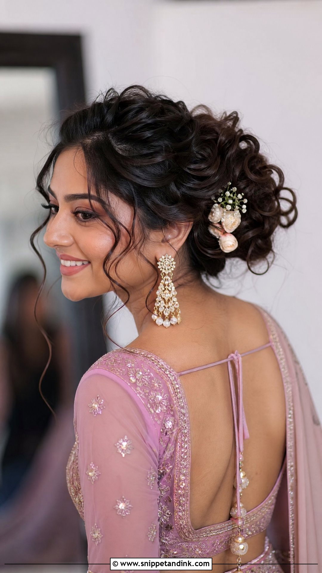 Curly Bun With Tendrils - Snippet and Ink - 25 Indian Wedding Hairstyle Ideas