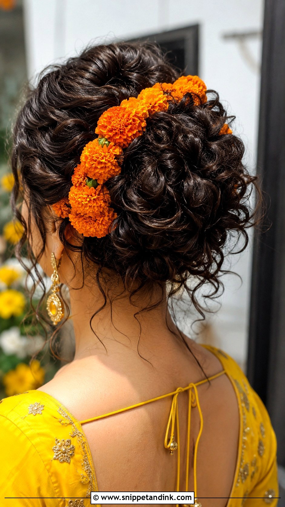 Curly Bun with Fresh Marigolds - Snippet and Ink - 30 Mehndi Hairstyles for Bride