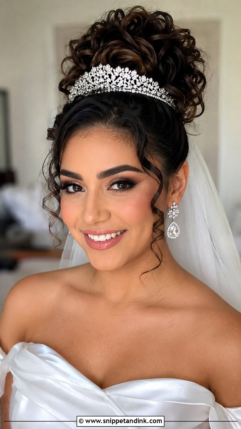 Curly High Bun With Statement Accessories - Snippet and Ink - 30 Curly Hair Wedding Styles