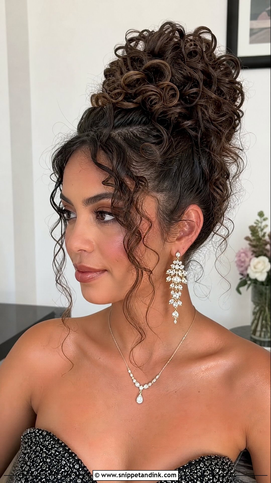 Curly High Bun With Tendrils - Snippet and Ink - 20 Naturally Curly Hair Wedding Styles