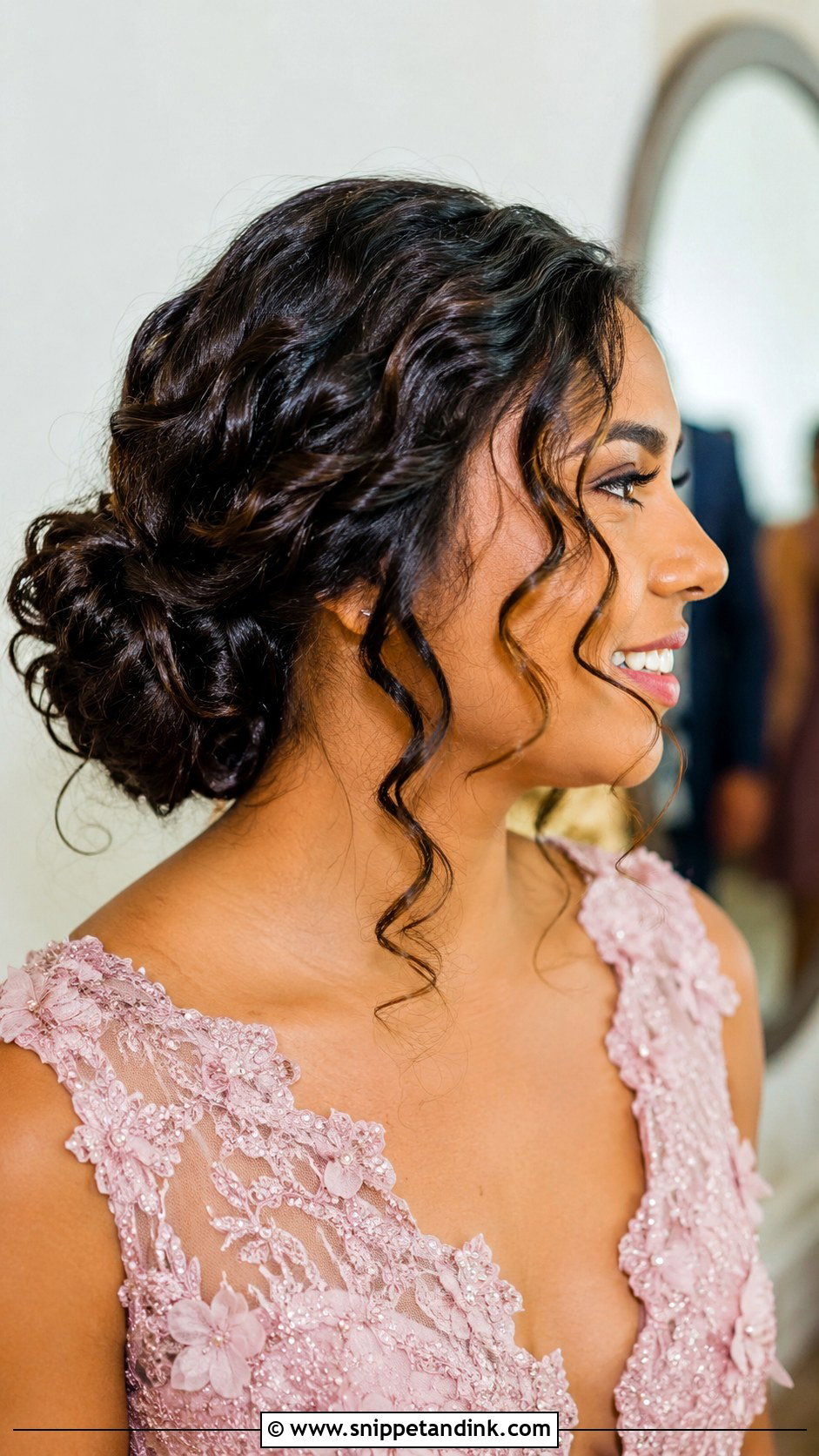 Curly Low Bun With Face Framing Tendrils - Snippet and Ink - 20 Wedding Guest Hair Curly Ideas