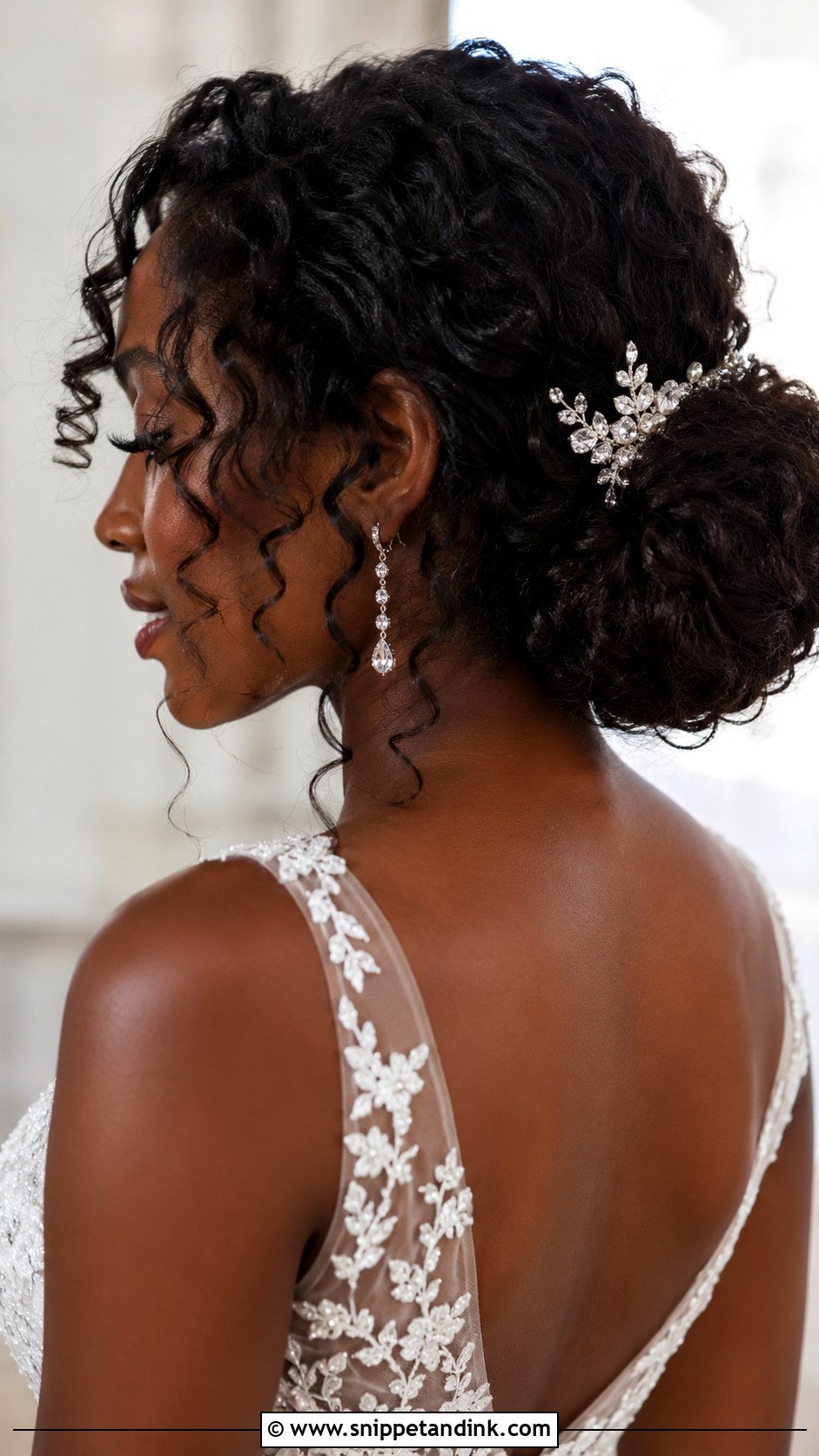 Curly Low Bun With Natural Texture - Snippet and Ink - 20 Low Loose Bun Wedding Ideas
