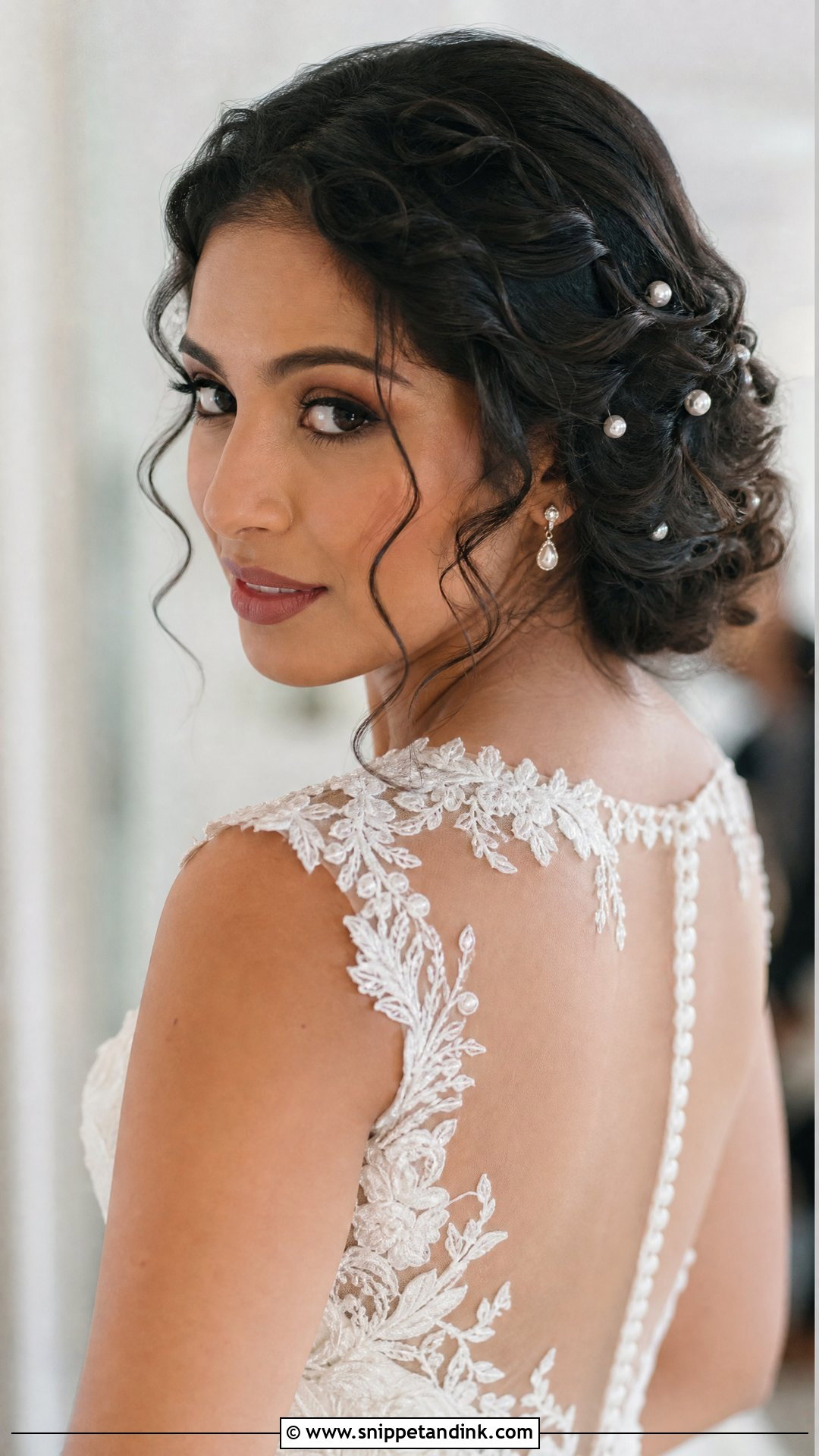 Curly Low Bun for Brides - Snippet and Ink - 20 Curly Wedding Hairstyle Ideas