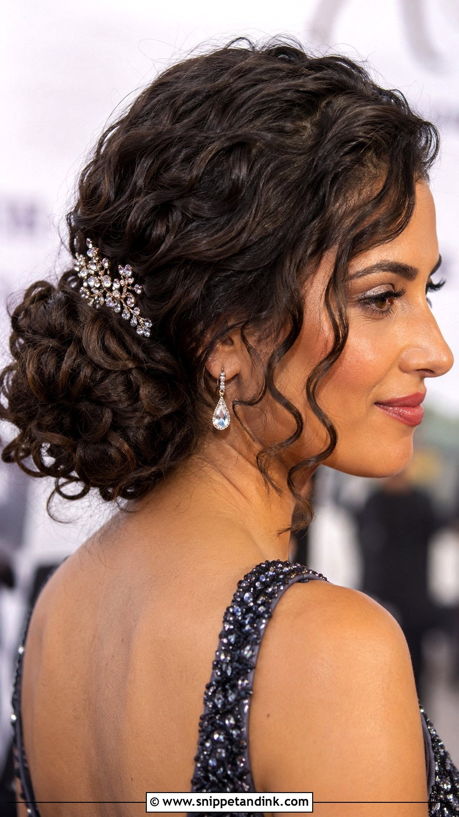 Curly Low Side Bun for Wedding Guest - Snippet and Ink - 25 Curly Hair Hairstyles for Wedding Guest