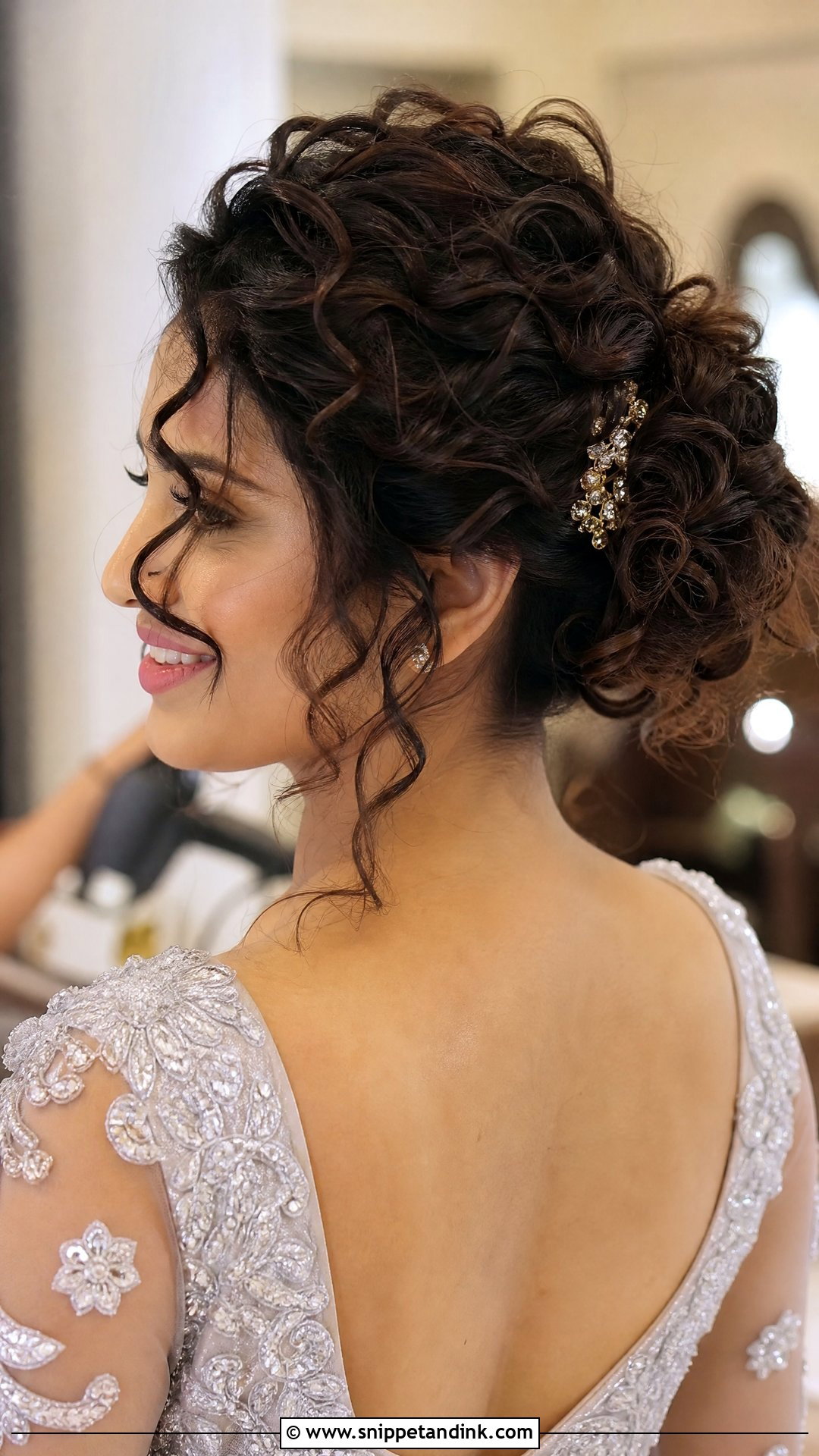 Curly Messy Bun For Reception - Snippet and Ink - 20 Indian Wedding Bun Hairstyle Ideas