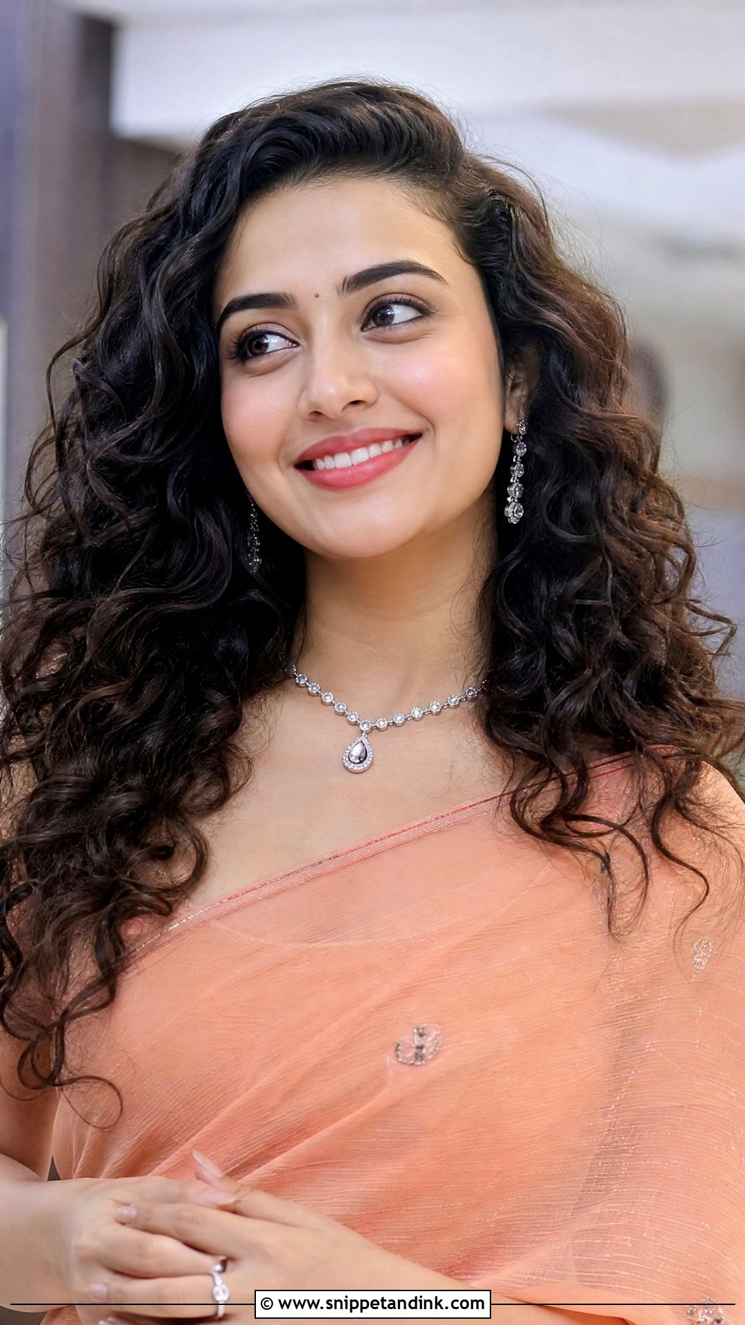 Curly Open Hairstyle With Volume - Snippet and Ink - 20 Indian Hairstyle for Mom of Bride Ideas