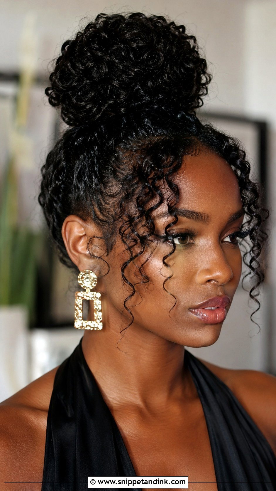 Curly Top Knot - Snippet and Ink - 25 Curly Hair Wedding Guest Styles
