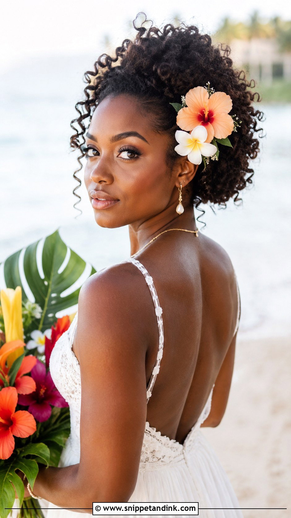Curly Updo With Tropical Flowers - Snippet and Ink - 20 Flower Wedding Hairstyles