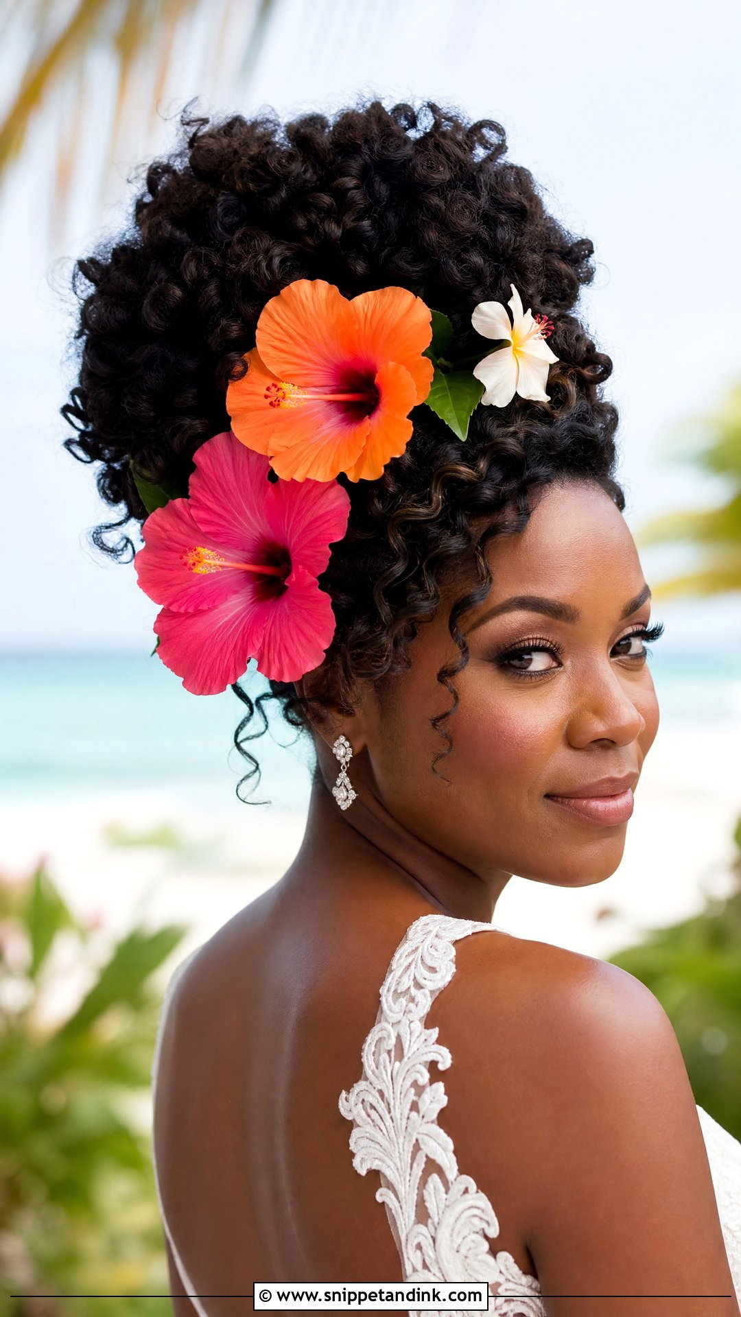 Curly Updo With Tropical Flowers - Snippet and Ink - 20 Bridal Hairstyles with Flowers