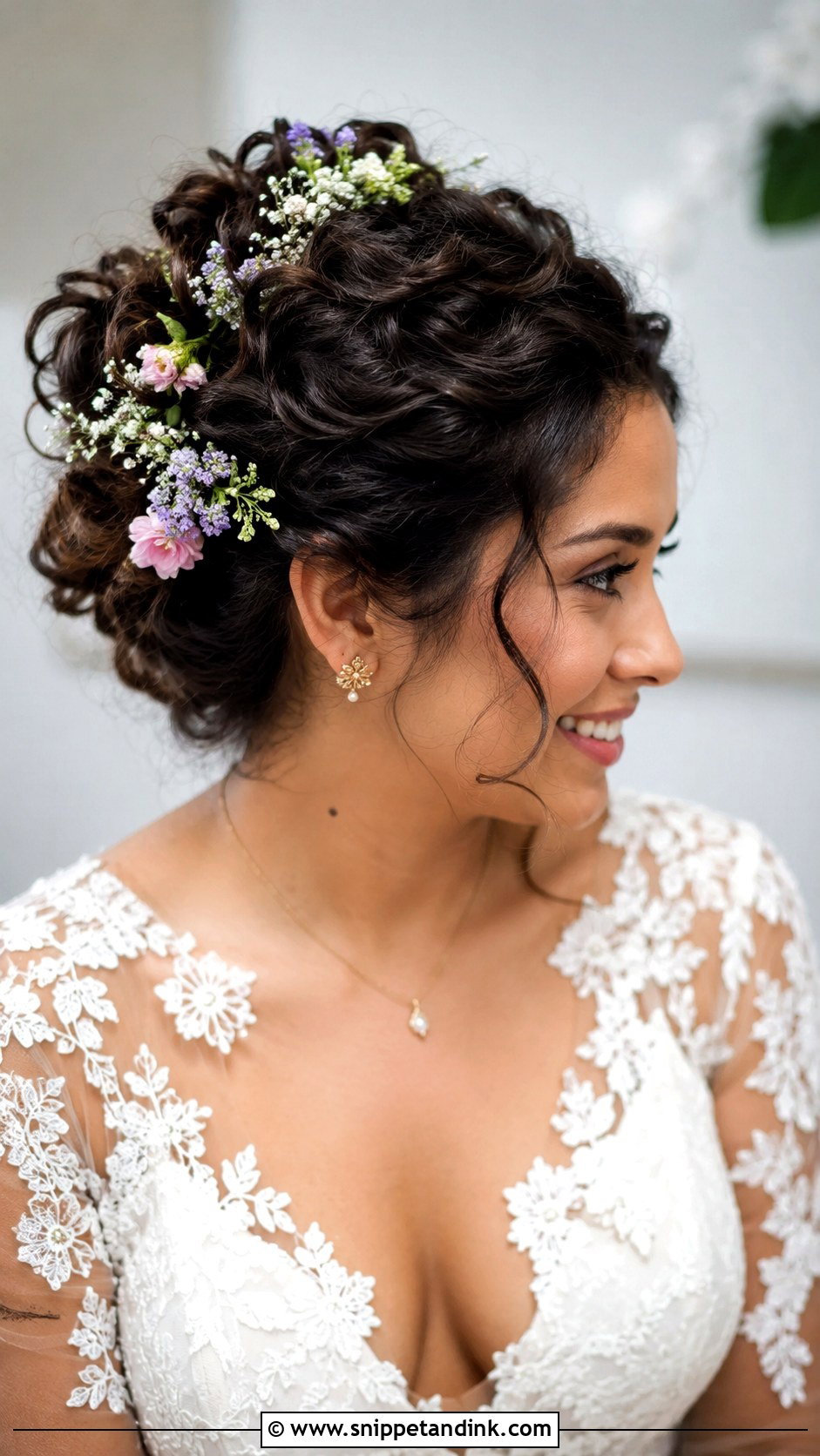 Curly Updo with Fresh Flowers - Snippet and Ink - 25 Natural Curly Wedding Hairstyles