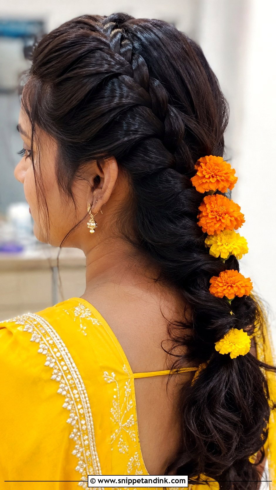 Dutch Braid With Fresh Flowers - Snippet and Ink - 25 Haldi Bride Hairstyle Ideas