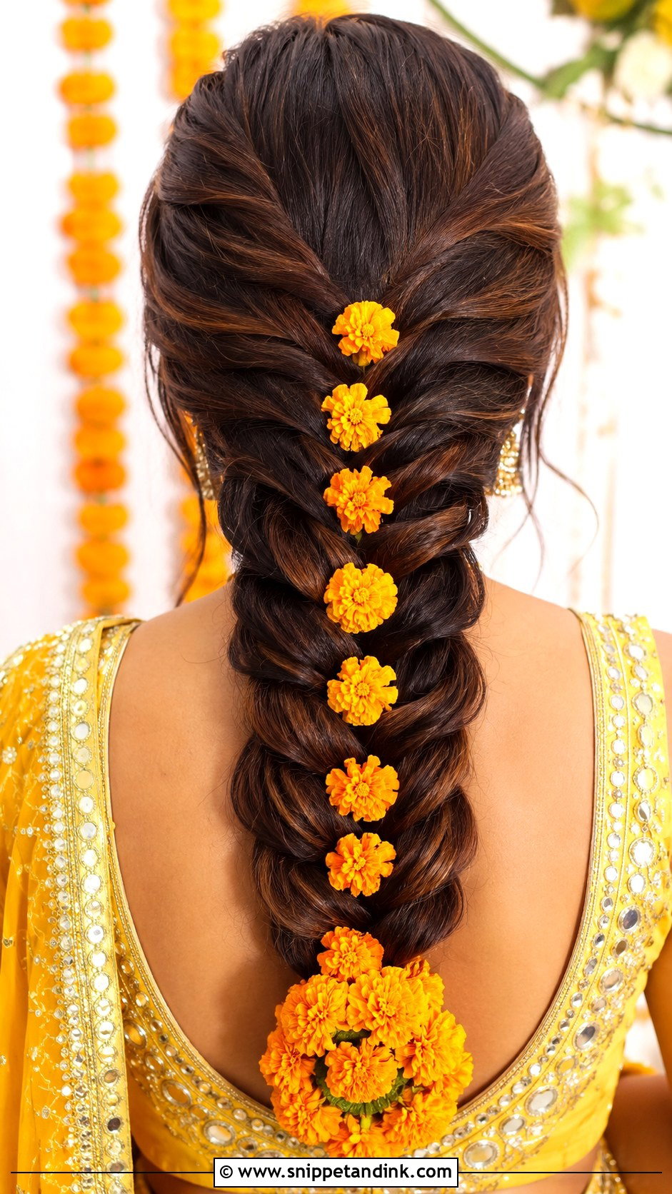 Dutch Braid With Marigold Garland - Snippet and Ink - 25 Haldi Ceremony Hairstyle for Bride Ideas