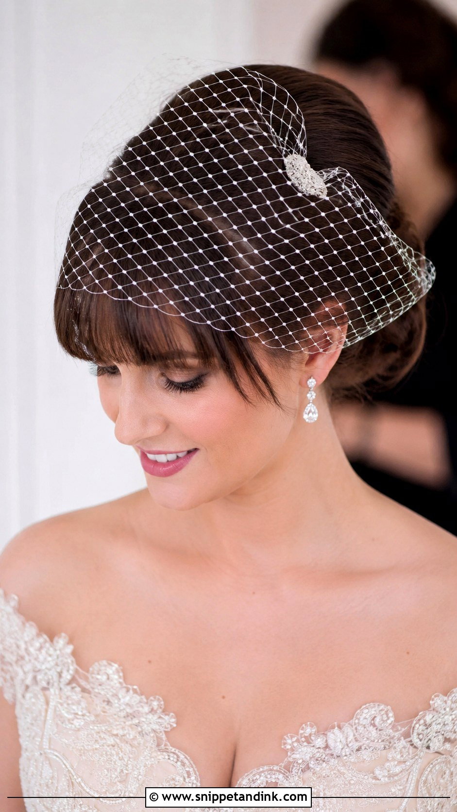 Elegant Bun With Birdcage Veil and Bangs - Snippet and Ink - 25 Wedding Hairstyles with Bangs