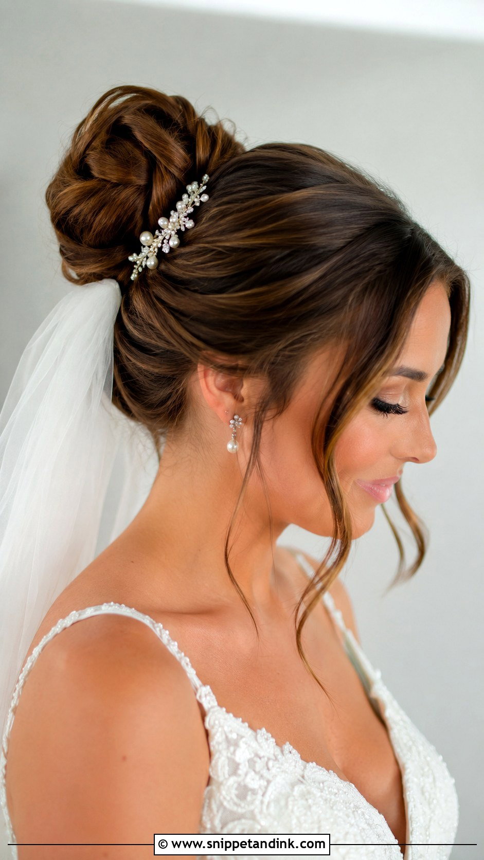 Elegant Bun With Veil - Snippet and Ink - 20 Easy Wedding Updos for Long Hair