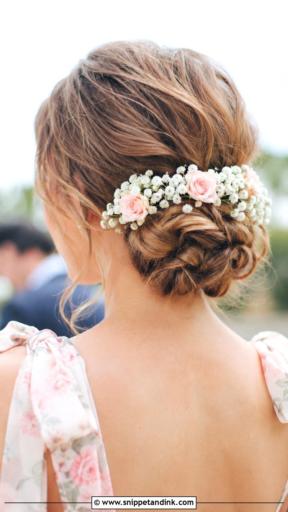 Floral Adorned Bun - Snippet and Ink - 20 Wedding Guest Bun Hairstyles