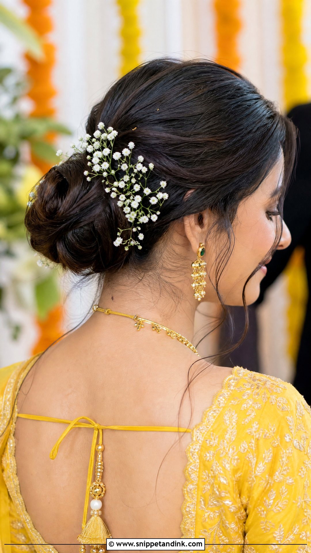 Floral Bun With Babys Breath - Snippet and Ink - 20 Hairstyle for Haldi Bride Ideas