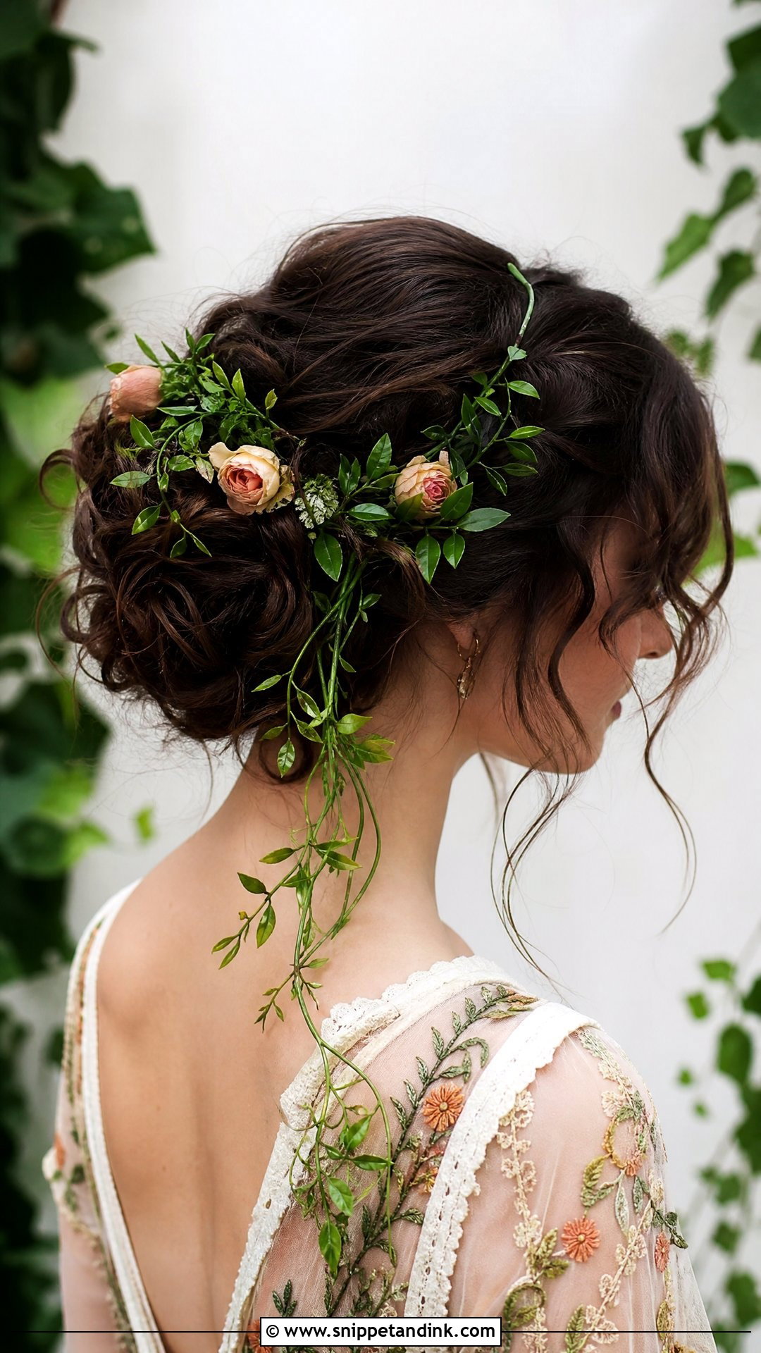Floral Bun With Greenery Vine - Snippet and Ink - 20 Floral Updo Ideas
