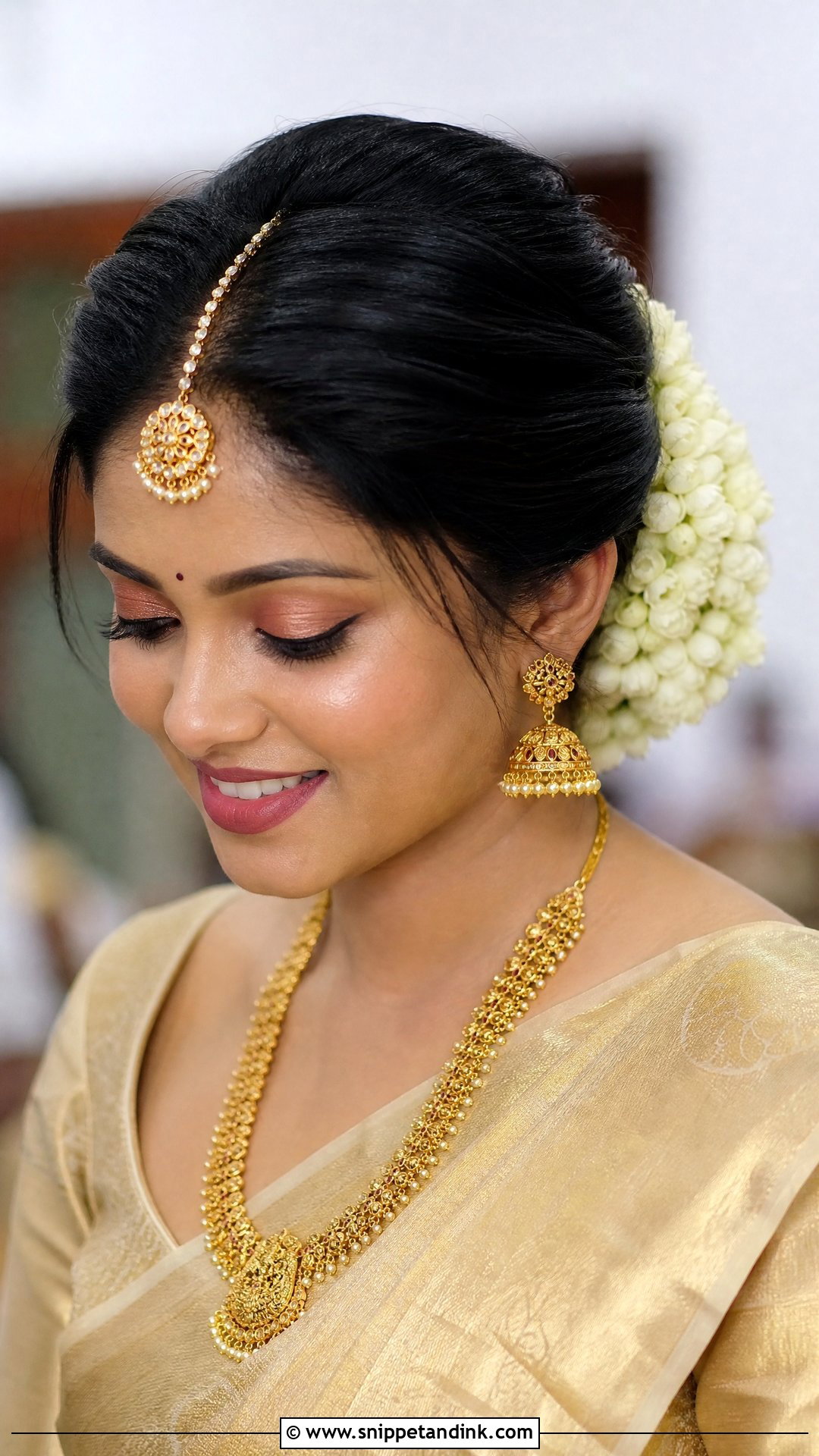 Floral Bun With Maang Tikka - Snippet and Ink - 30 Kerala Bride Hairstyles