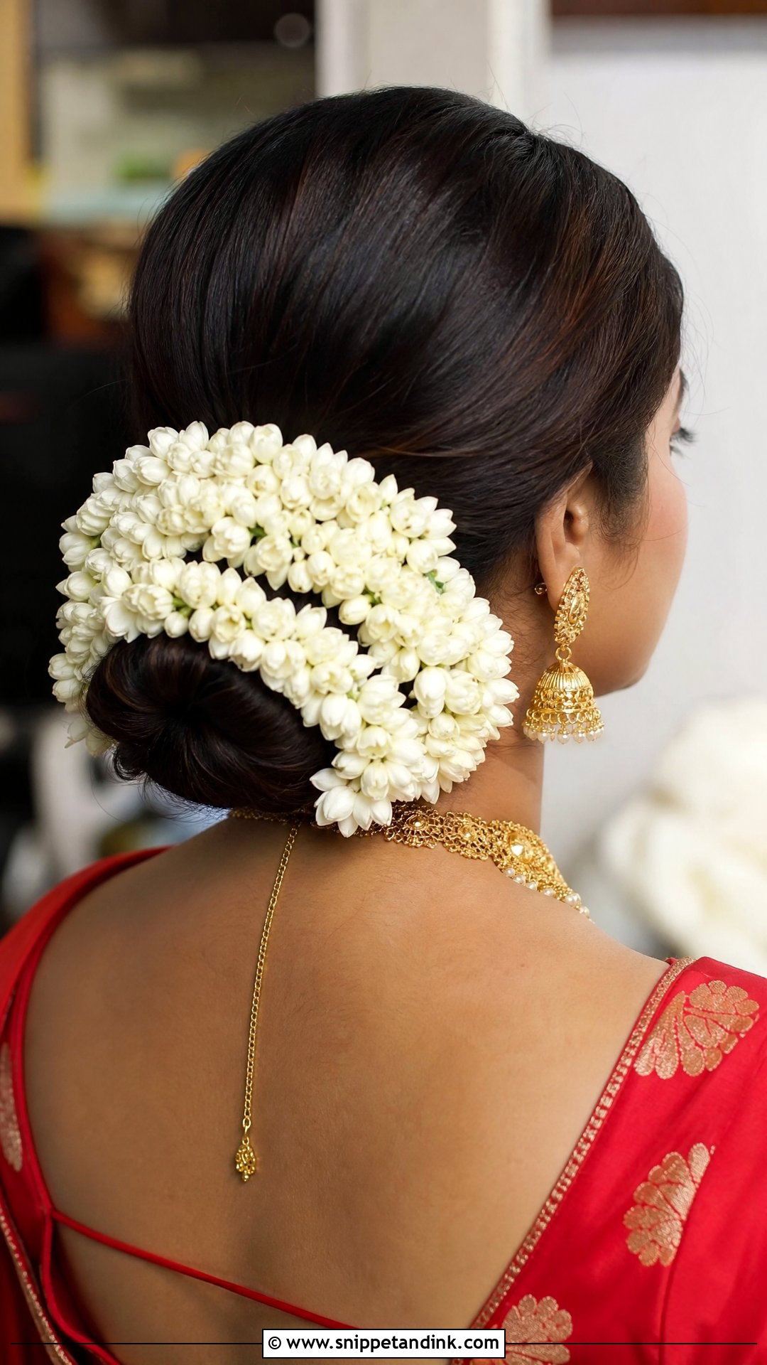 Floral Gajra Wrapped Low Bun - Snippet and Ink - 20 Bengali Bridal Hairstyle Ideas