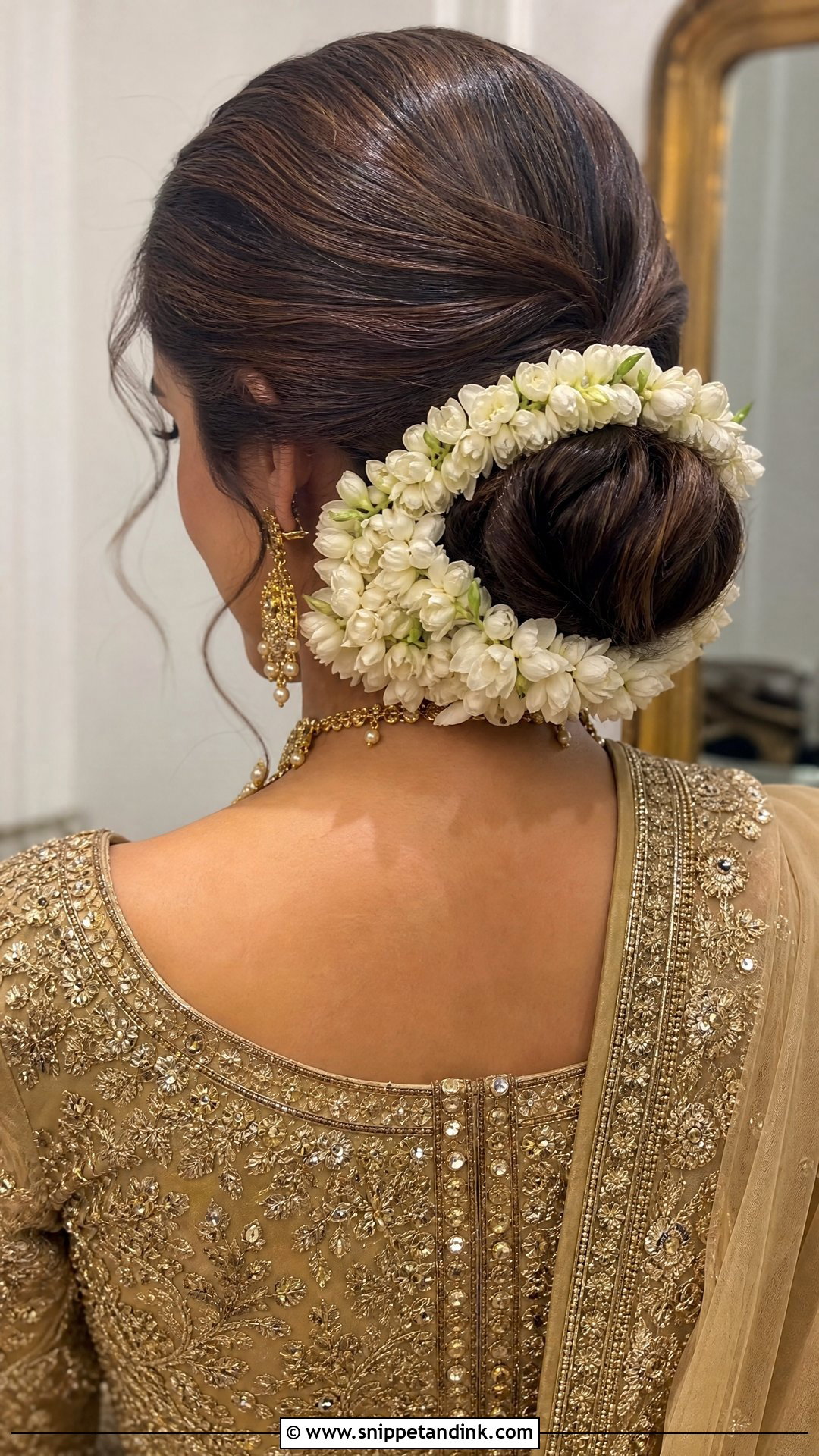 Floral Low Bun With Gajra - Snippet and Ink - 20 Walima Bridal Hairstyle Ideas