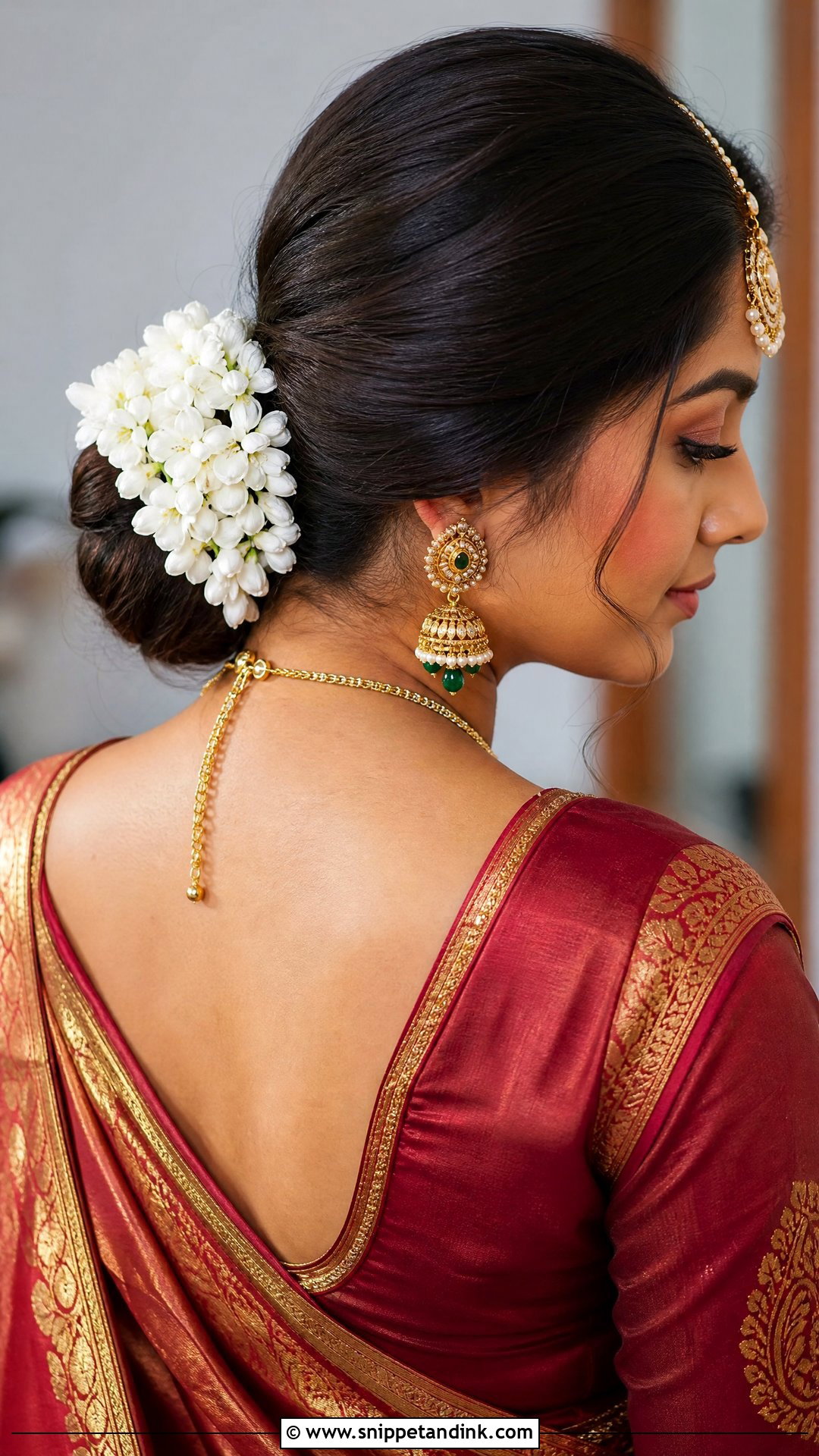 Floral Low Bun for Saree - Snippet and Ink - 20 Indian Hairstyles for Wedding Guest