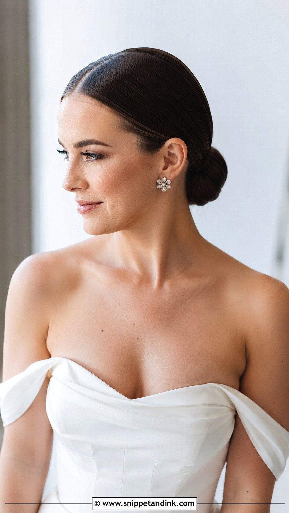 Glossy Center Part Low Bun - Snippet and Ink - 25 Hailey Bieber Wedding Hair Ideas