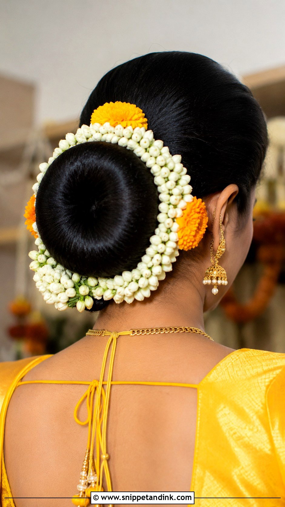 Haldi Donut Bun With Flowers - Snippet and Ink - 35 Haldi Hairstyles for Bride