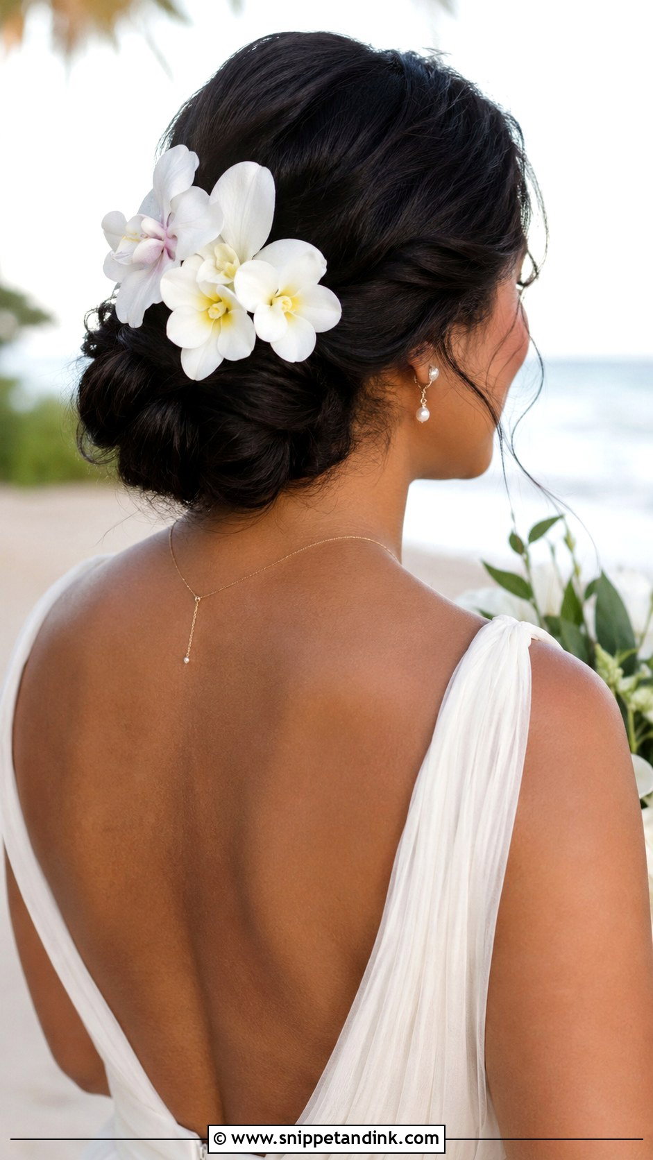 Hawaiian Wedding Low Bun With Flowers - Snippet and Ink - 15 Hawaiian Wedding Hair Ideas